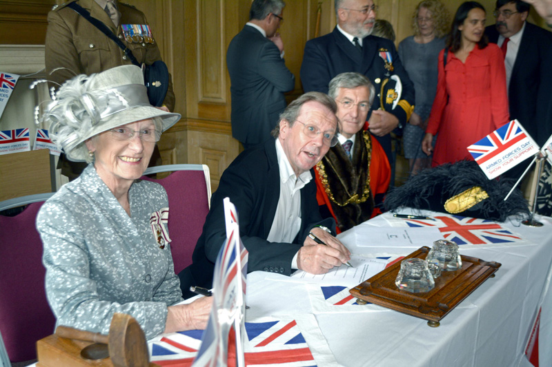 The Mayor of Bristol, George Ferguson, is first to sign the Covenant, watched by the Lord-Lieutenant, Mary Prior MBE, and the Lord Mayor, Cllr Alastair Watson (right).