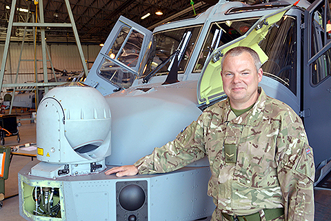 Lance Corporal Andrew Donovan with an Army Air Corps Wildcat in the hangar at Yeovilton. Picture: Fortuis Media